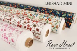 Arvidssons textil Gardintyger Mönstrade|Arvidssons Textil|Leksand mini natur tyg med traditionellt dalahästtryck